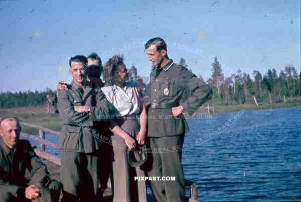 134th Gebirgsjaeger Division soldiers with a local woman in Finland 1944