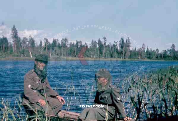 134th Gebirgsjaeger, Finland 1944, german soldier in boat on river, mosquito mask