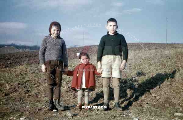 3 children standing on a field in Germany 1937
