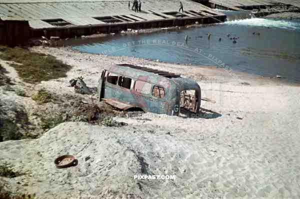 A destroyed German army Bus near the main bridge in Orel Russia 1941