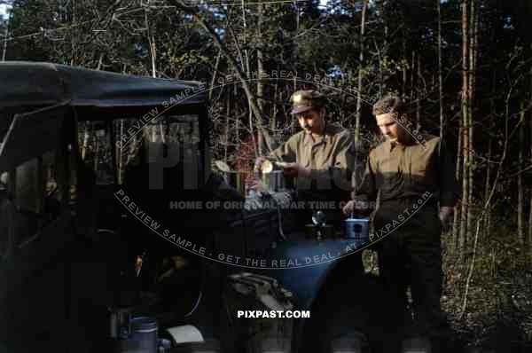 American airforce officers eat K rations beside 1942 Dodge WC-51 3/4 ton Weapons Carrier, France 1944.