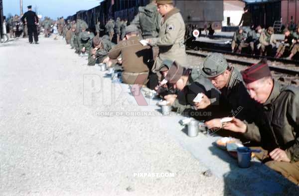 American soldiers eating lunch in main train station in Worms Germany 1945