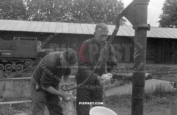BW France 1940 German soldiers wash hands with captured french panzer tank transporter
