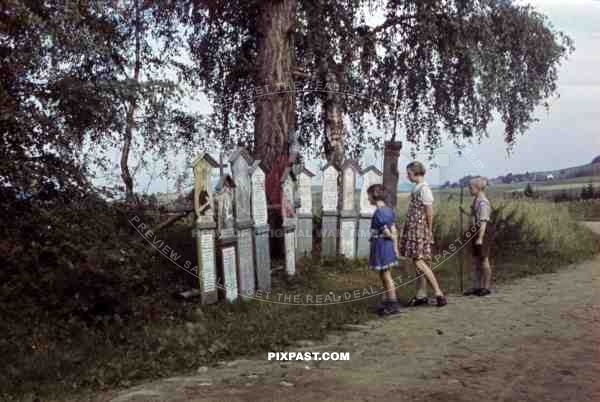 Children reading religious plaques near Pottenstein, Germany 1939