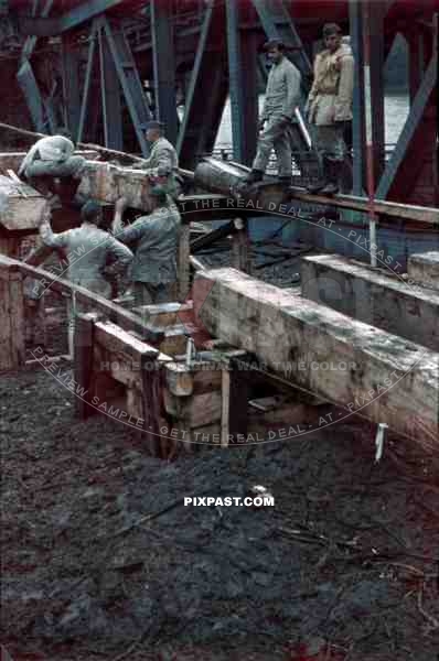 construction of a wooden bridge next to a broken rail bridge near Belgrade, Serbia ~1941
