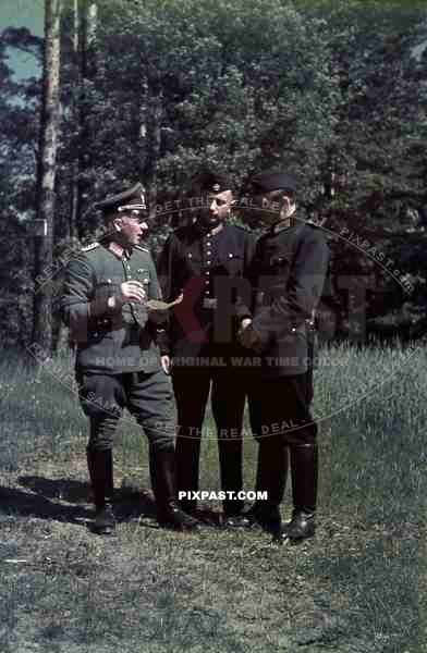 field police officer map reading two men in black police uniform 1939