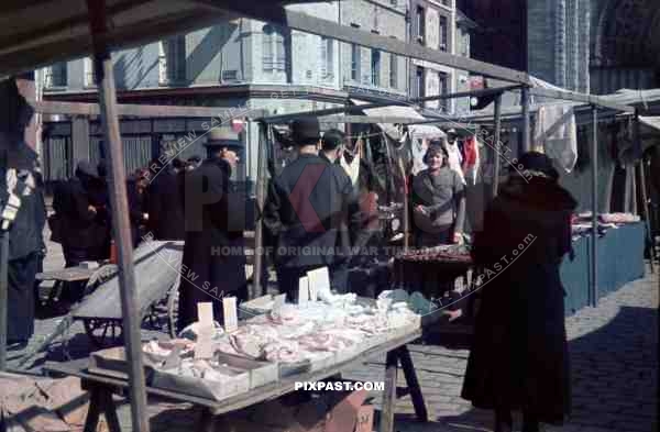 Food and Flea Market behind Notre Dame Cathedral, Paris, France, 1940.