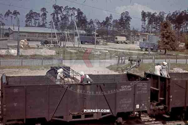 Forced labour, Finland, 1944, women loading German army trucks from train wagons, camo truck,