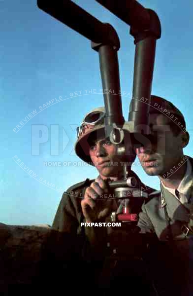 German Afrika Korp soldier in Pith Helmet & goggles with Italian officer using Trench periscope. Tunisia 1942.