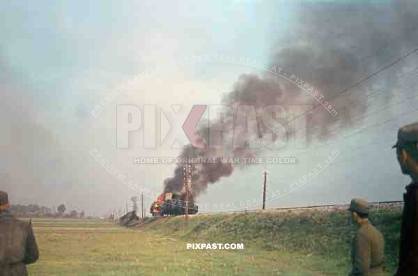 German army supply train burning after Russian air force aerial attack. Poland 1944.