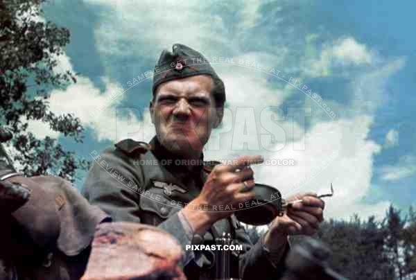German artillery soldier near French coast France 1940 not enjoying his food rations.