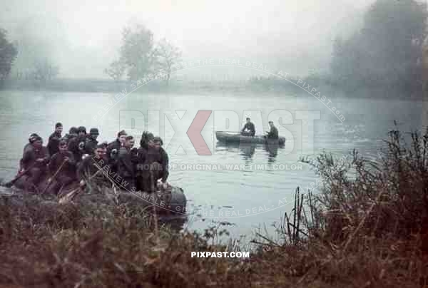 german combat troops helmet boat french river 1940