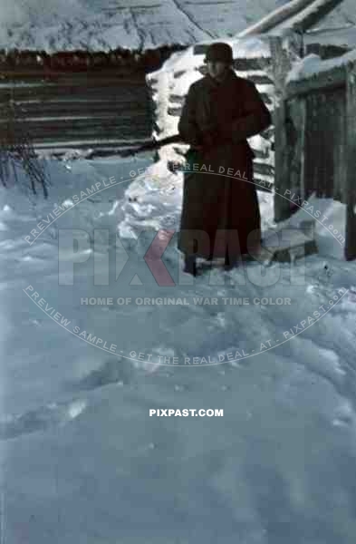 German guard sentry winter jacket mantel helmet stahlhelm m40 and kar98 rifle in Russian winter snow 1944