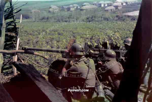 German infantry with 50mm PAK cannon targets Russian village, Southern Russia 1942 near Stalingrad area.