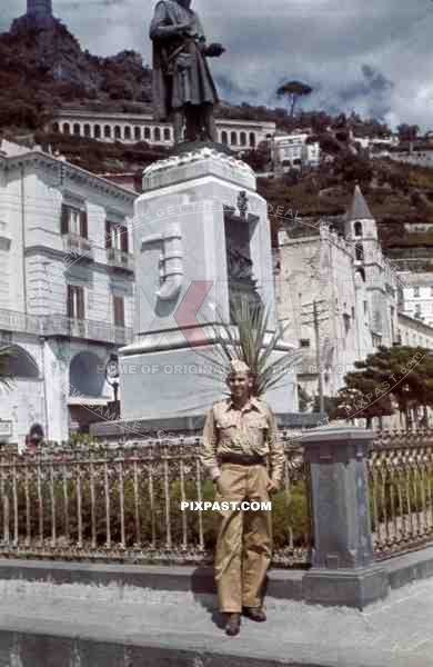 German Luftwaffe soldier in front of statue in Amalfi, Italy ~1942