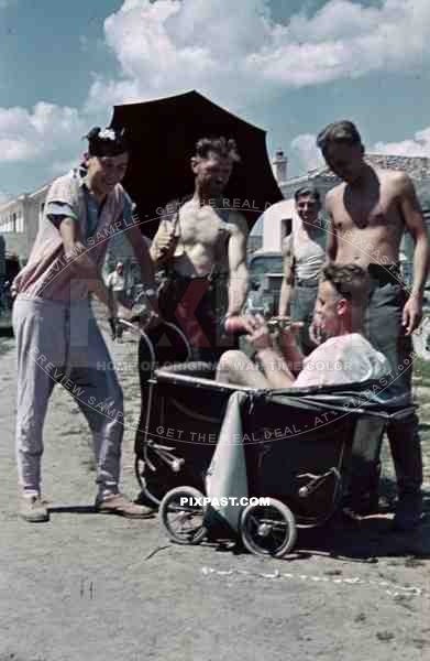 German medical ambulance red cross troops play joke humor Italy 1943 baby pram wagon drink alcohol wine funny