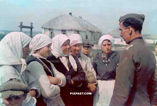 German Propaganda war reporter talking to Russian farmers. Area near Stalingrad Russia 1942.