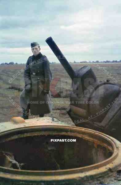 German soldier inspecting the destroyed turret of a Russian Soviet KV 1 Heavy Tank. Russia 1941. Kliment Voroshilov