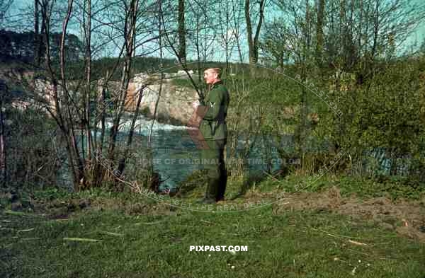 German soldier of the 4th Panzer Division rest beside River in France. 1940.