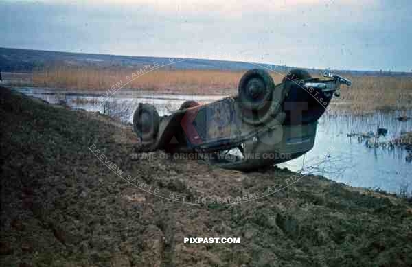 German staff car crashed or hit by mine in big swamp. Russia 1942