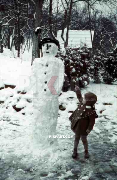 little girl with a snowman, Germany 1939