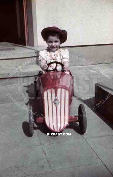 little girl with pedal car, Germany 1939