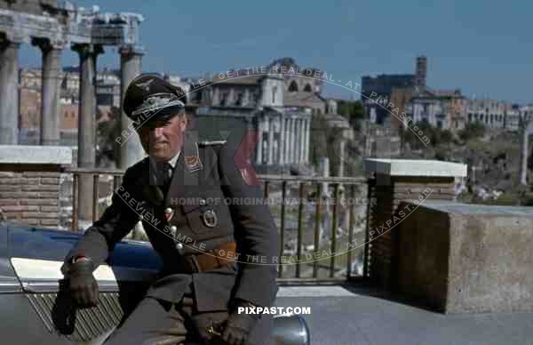 Luftwaffe flak officer with Krim Shield of the Leichte Flak Abteilung 99 (mot) in Rome Italy 1944 with staff car.