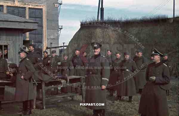 Mariupol Ukraine, 1942, German officers practice rifle training Kar98 in front of factory and panzer werkstatt, armband.
