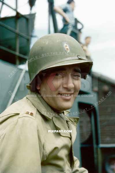 Member of the 166th Signal Company. On board a landing craft off shore from the beaches of Omaha Normandy D-Day plus 10