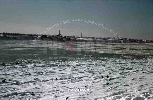 Minsk, Russia, 1942, snow, winter, Village and factory in front of frozen river.