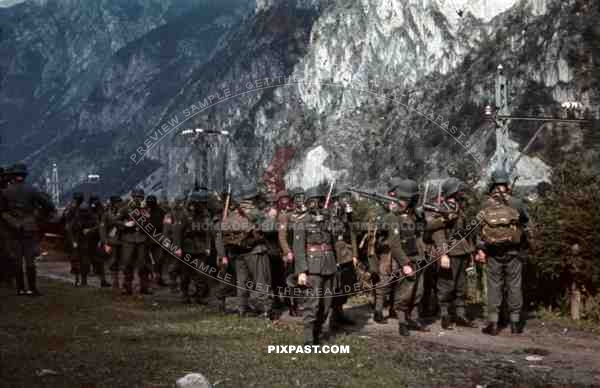 mountain troopers marching with gas masks in Landeck, Austria 1941