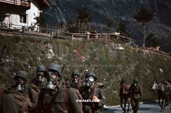 mountain troopers marching with gas masks in Landeck, Austria 1941