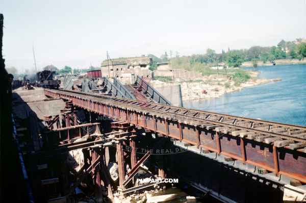 New train bridge constructed over the Rhine River beside German Bunker. Worms Germany 1945