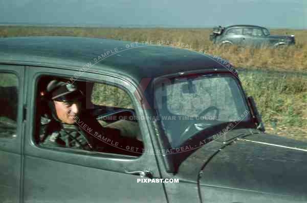 Officer of the 97. Jager-Division July 1942 Rostow Russia. being driven in his Opel Olympia staff car