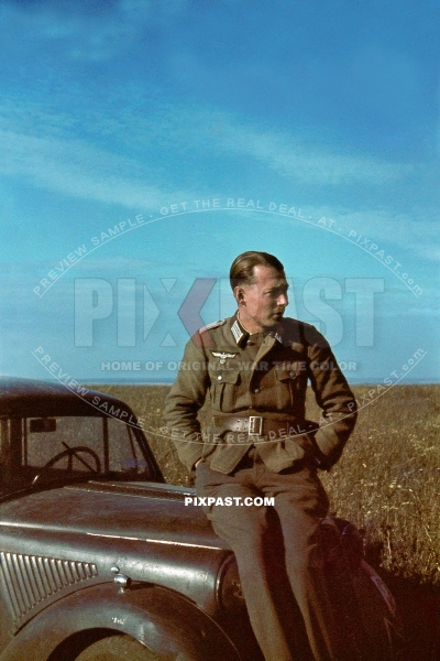Officer of the 97. Jager-Division July 1942 Rostow Russia. being driven in his Opel Olympia staff car