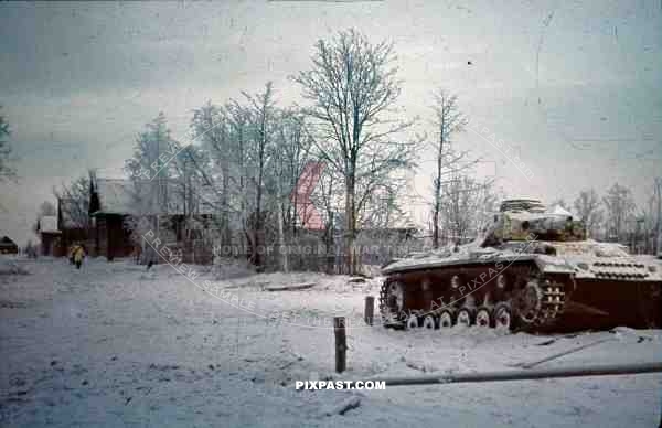 Panzer III equipped with the L42 50mm gun and winter white camo. Russian village. 207 Infantry Division. Russia 1942