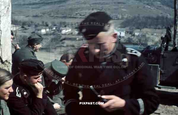 Panzer officer smoking pipe, staff meeting, Don, Rostow, July 1942, 22nd Panzer Division. PKW Horch 901.