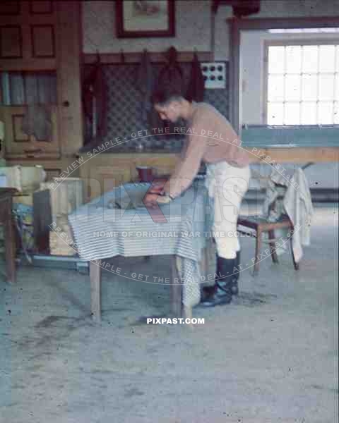 RAD soldier folding clothes in kaserne uniform boots 1939