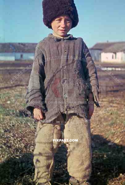 Russian farmer boy in traditional cloths photographed by German war reporter on the Russian Front 1943