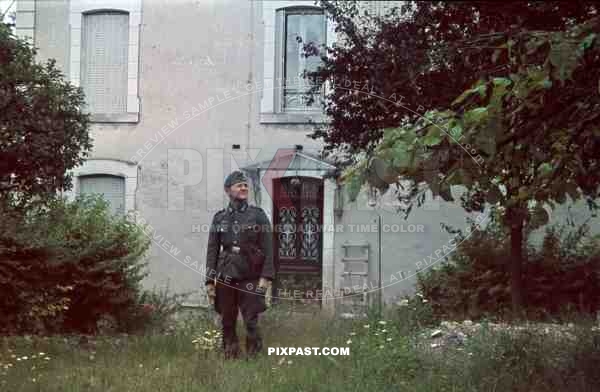 soldier standing beside staff quarters france 1940
