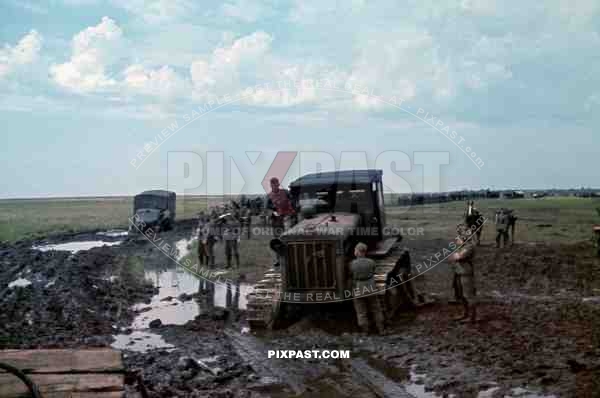Soviet tractor S-65 used to pull out Wehrmacht trucks out of the mud, September 1941. Poltava, Donez, Ukraine. 