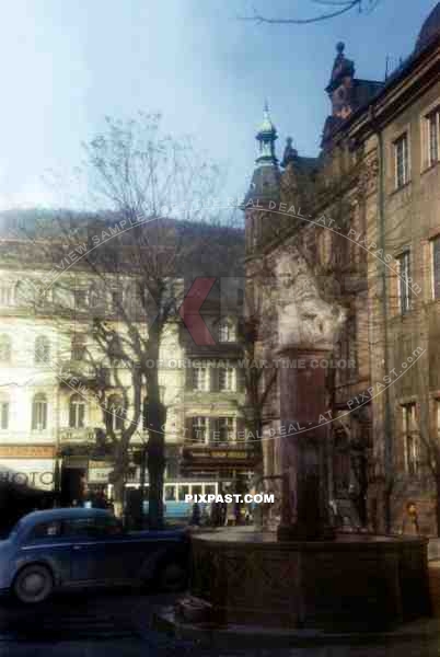 The Lions Well Lowenbrunnen fountain in Universitatsplatz in front of the Old University Heidelberg Baden Wurttemberg 1945