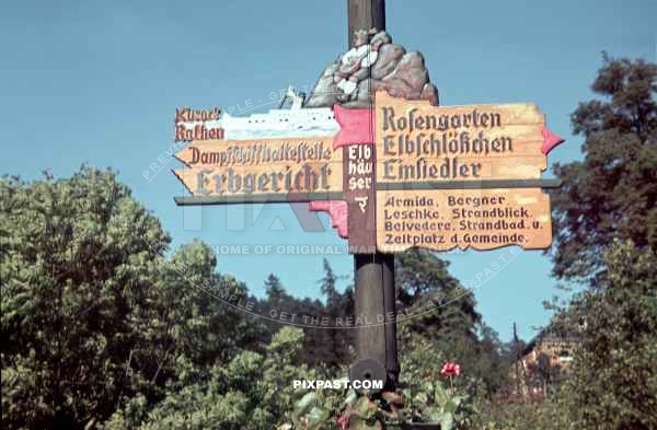 Traditional German painted wooden road sign beside the Elbe River. Germany 1939