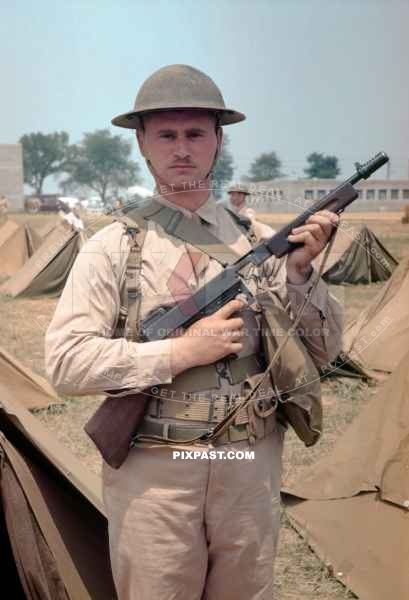 US Infantry GI wearing a Dough Boy Style M1917 Helmet and Tommy Gun. California USA 1938