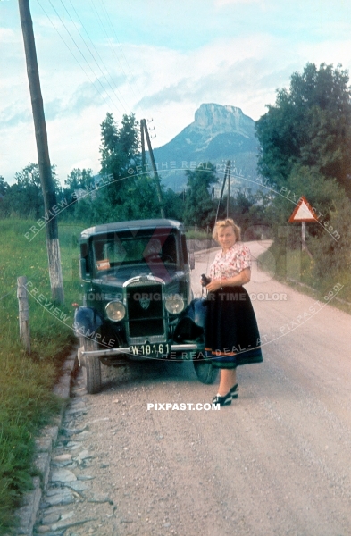Vienna wife standing beside her classic car Peugeot 201 1930 Austria 1938