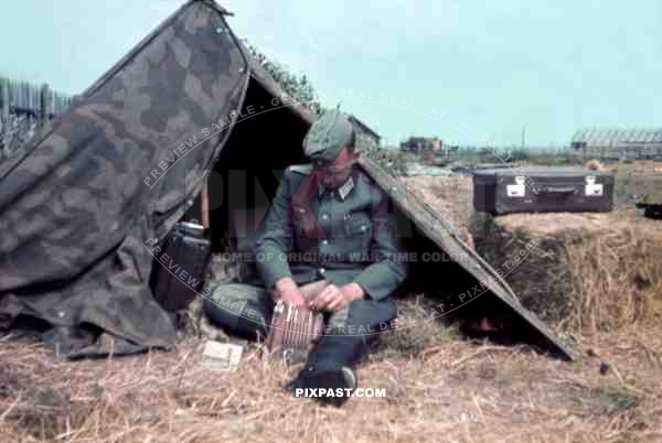 Wehrmacht Doctor preparing his map case in army tent. Russian Front 1941. Arztes San.Kp.126. Heeresgruppe Nord