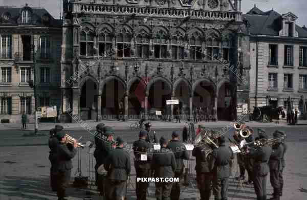 wehrmacht music band playing in front of the town hall of Saint Quentin, France 1940