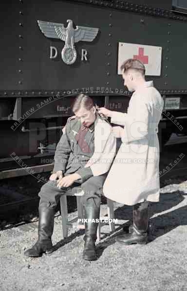 Wehrmacht soldier getting haircut near the Leipzig main station, Germany 1941