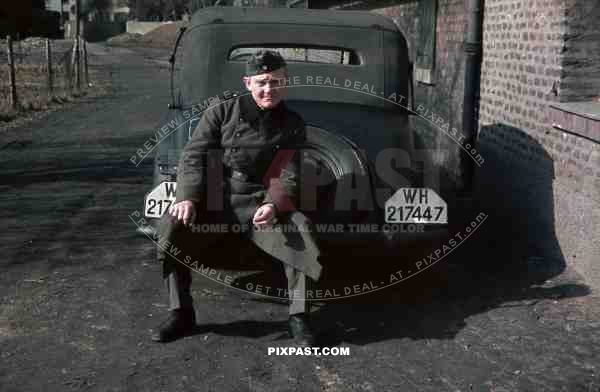 Wehrmacht soldier in NiederauÃŸem (Von-Galen-Weg), Germany 1940. Adler 2 Liter Cabriolet EV 1938. 4th Panzer Division.