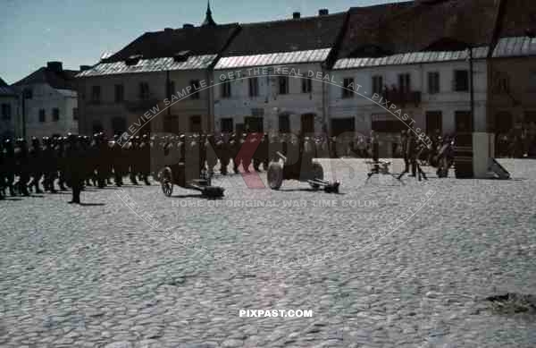 Wehrmacht soldier parade PAK cannon machine gun MG34 town Germany 1940